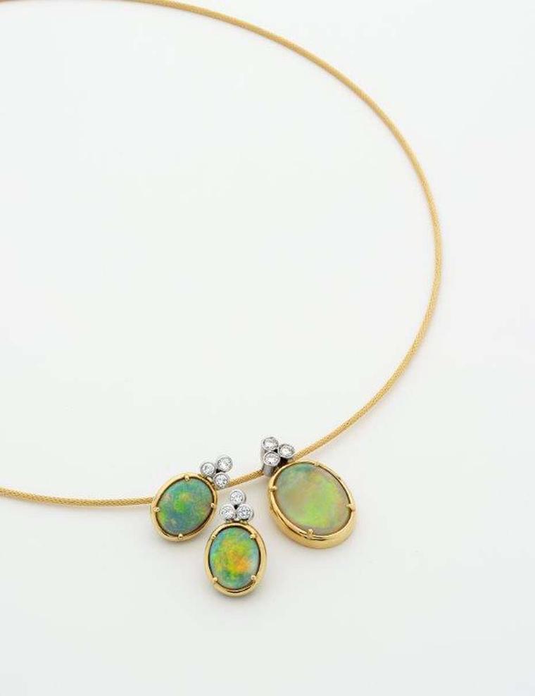 Percy Marks pendant set with 4.67ct Coober Pedy opals on a yellow gold fine cable necklet, topped by three brilliant-cut white diamonds, complete with matching earrings.